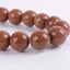Angelstones Synthetic Goldstone 10mm Round Beads Stretch Bracelet 7inch Unisex