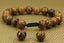 Angelstones Handmade Gemstone 10mm Tiger Skin Jasper Round Beads Adjustable Braided Macrame Tassels Chakra Reiki Bracelets 7-9 inch Unisex